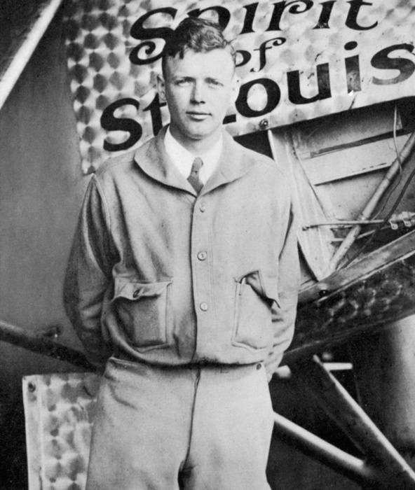 Charles Lindbergh  unknown date  Charles Lindbergh  1902 1974  in his flying kit standing by  Spirit of St Louis , the plane in which he made the first non stop Atlantic air  crossing: 20 21 May 1927. Landed at Le Bourget Airdrome, Paris, after a flight of 33.5 hours.
