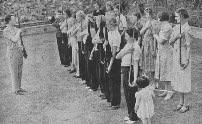 World War II Members of the Women s Volunteer Defence Corps being trained in rifle drill:1940. Small arms were in short supply and only the instructor has a weapon, the women are improvising with walking sticks, umbrellas and even broom handles  World War II.