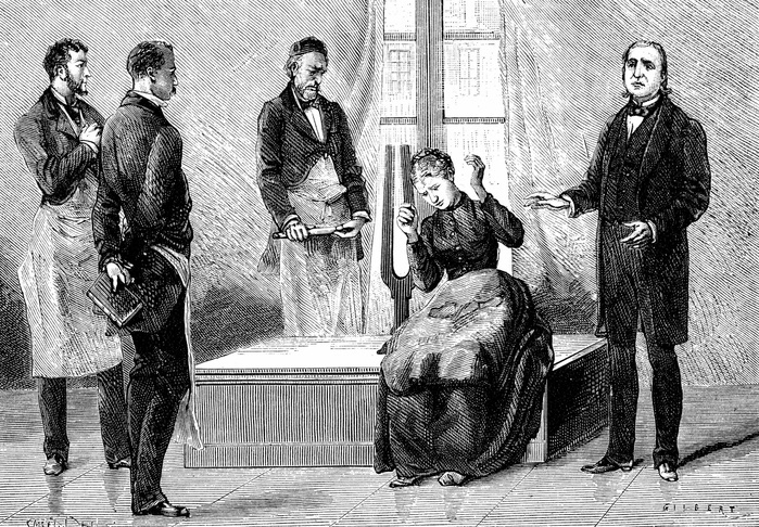 Jean Martin Charcot (1825-1903) French neurologist and pathologist, on right, demonstrating production of hypnosis using the sound from a large tuning fork. Picture drawn from life at the Salpetriere Hospital, Paris. Freud heard of posthypnotic suggestion from Charcot. Engraving from 'La Nature', Paris, 1879.