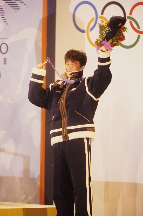 1998 Nagano Olympics Ski Jumping Individual LH Commendation Ceremony, Harada wins Bronze Medal. Masahiko Harada  JPN    Ski Jumping   FEBRUARY 15, 1998 FEBRUARY 15, 1998   Ski Jumping : Masahiko Harada of Japan celebrates on the podium with his bronze medal at the medal ceremony for the Individual Large Hill  K120  during the Nagano 1998 Olympic Winter Games at Central Square in Nagano, Japan.  Photo by AFLO SPORT   0006 .