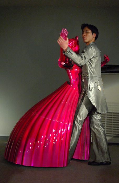 World s Inventions Extra Edition Evolving human like robots  June 4, 2005  Mobile Smart Dance Robot PBDR Dancer  Partner Ballroom Dance Robot   A robot dance partner,  PBDR Dancer, dances with the lead of a man in Chino, central Japan, June 4, 2005. PBDR Dance was manufactured by Nomura Unison Co Ltd and Tohoku University.a dance partner robot referred to as PBDR Dance, which has been developed as a platform for realizing effective human robot coordination with physical interaction. PBDR Dance consists of an omni directional mobile base to realize various dance steps in a ballroom dance and the force torque sensor referred to as Body Force Sensor to realize compliant physical interaction between the PBDR Dance and a human based on the force moment applied to the human. photo by fujifotos   Photo by Fujifotos AFLO   3618 