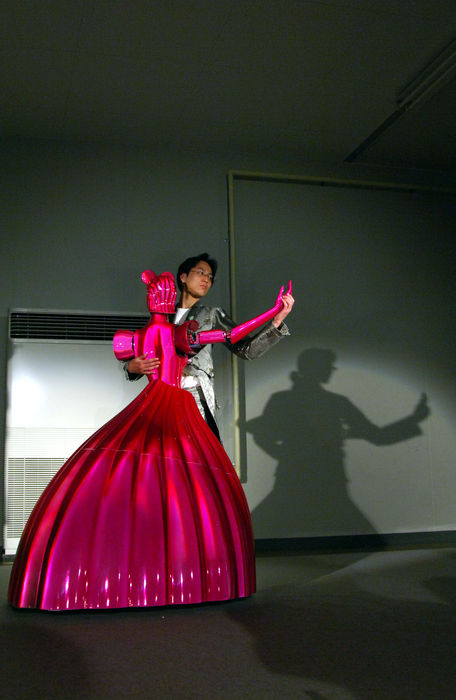 World s Inventions Extra Edition Evolving human like robots  June 4, 2005  Mobile Smart Dance Robot PBDR Dancer  Partner Ballroom Dance Robot   A robot dance partner,  PBDR Dancer, dances with the lead of a man in Chino, central Japan, June 4, 2005. PBDR Dance was manufactured by Nomura Unison Co Ltd and Tohoku University.a dance partner robot referred to as PBDR Dance, which has been developed as a platform for realizing effective human robot coordination with physical interaction. PBDR Dance consists of an omni directional mobile base to realize various dance steps in a ballroom dance and the force torque sensor referred to as Body Force Sensor to realize compliant physical interaction between the PBDR Dance and a human based on the force moment applied to the human. photo by fujifotos   Photo by Fujifotos AFLO   3618 