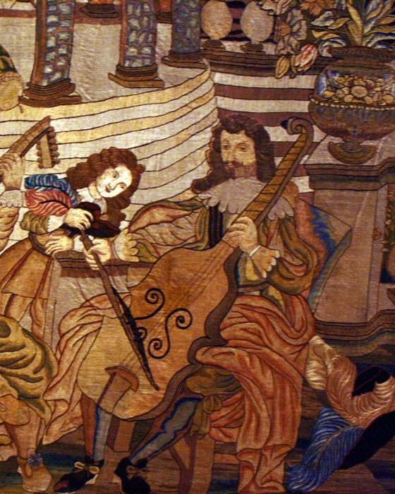 A well-dressed man and woman make music in a fanciful setting of a noble residence with a formal garden.  Servants attend them, and animals including a pet monkey and a peacock are also prominent, evoking the wealth and taste for luxury of the group.  The harmony of music can symbolize love and fidelity but the sounds and pleasures of music fade, as do fruit and flowers.  The embroidery, which may be Spanish, once had a decorative border that probably included the client's coat of arms.  Music was an important part of social life.