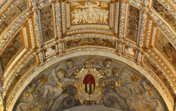 (Detail)The ceiling of the Scala D'oro (Golden Staircase) from the Doge's Palace in Venice, Italy. Its two most visible façades look towards the Venetian Lagoon and St. Mark's Square, or rather the Piazzetta. The use of arcading in the lower stories produces an interesting 'gravity-defying' effect. There is also effective use of color contrasts. It replaced earlier fortified buildings of which relatively little is known. Giovanni and Bartolomeo Bon created the Porta della Carta in 1442, a monumental late-gothic gate on the Piazzetta side of the palace. The palace was badly damaged by a fire on December 20, 1577.
