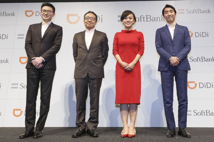 SB, a joint venture with a major Chinese car delivery application company Ken Miyauchi  C L  CEO of SoftBank Group Corp. and Jean Liu  C R  President of DiDi Chuxing pose for the cameras during a news conference on July 19, 2018, Tokyo, Japan. Japanese telecommunications and investment giant SoftBank and Chinese mobile transportation platform DiDi Chuxing announced that they will launch a taxi hailing service in Japan. The service will be called Didi Mobility Japan and plans to start trials in major cities including Osaka, Kyoto and Tokyo later this year.  Photo by Rodrigo Reyes Marin AFLO 