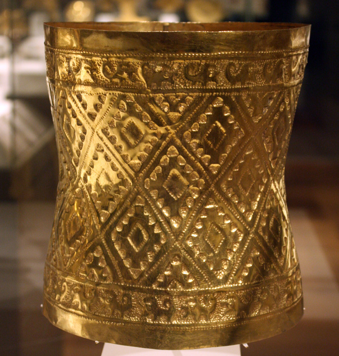 Crown. Peru: Sican (Lambayeque) 9th-11th century.  Hammered gold. In the burial of a high-status Sican lord, archaeologists discovered 1.2 tons of grave goods, including a large treasure box that held more than sixty ornaments of sheet gold. Most were head ornaments.