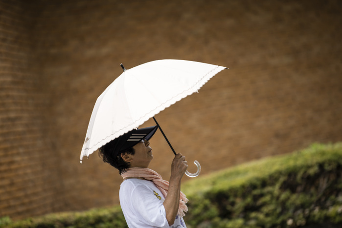 Heat Wave Grips Japan JULY 25, 2018   A woman uses a parasol to avoid the sun at Higashiyama Zoo and Botanical Garden in Nagoya, Japan. High temperatures continued throughout the country on Wednesday. The Japan Meteorological Agency has declared the ongoing heat wave a natural disaster, with 65 deaths reported in the past week. The agency has forecasted continued high temperatures in the coming weeks.  Photo by Ben Weller AFLO   JAPAN   UHU 