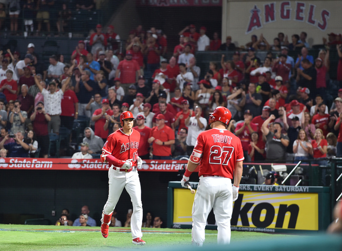 2018 MLB Los Angeles Angels designated hitter Shohei Ohtani is greeted by teammate Mike Trout after hitting a two run home run in the fifth inning during the Major League Baseball game against the Chicago White Sox at Angel Stadium in Anaheim, California, United States, July 25, 2018.  Photo by AFLO 