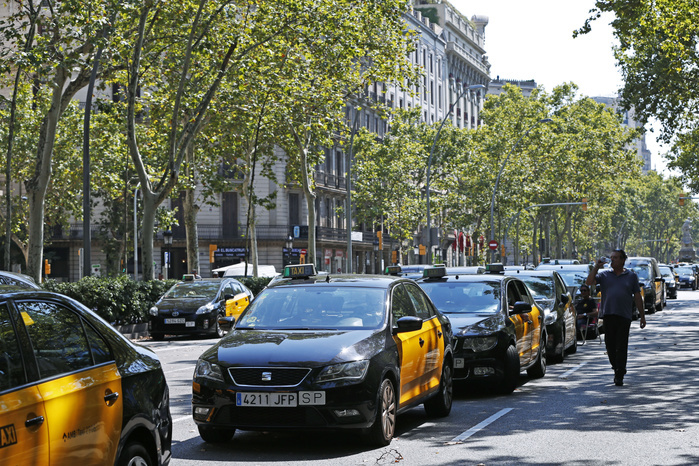 Spain Taxi Drivers Go on Strike Taxi drivers block the Gran Via avenue in Barcelona, Spain, Thursday, AUGUST 1, 2018. Taxi drivers in Barcelona are blocking traffic on a major thoroughfare as part of an indefinite strike to protest the use of ride hailing apps like Uber and Cabify.  Photo by D.Nakashima AFLO 