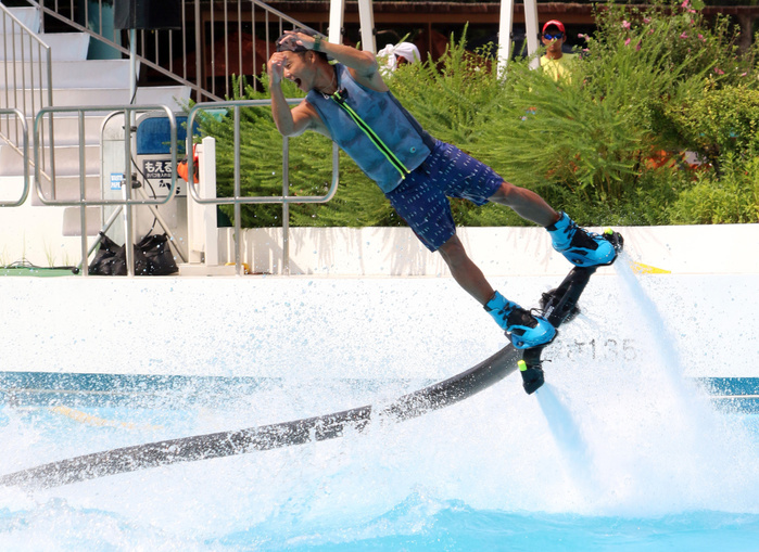 Continuing heat wave throughout the archipelago, swimming pools in central Tokyo were crowded. August 10, 2018, Tokyo, Japan   A Japanese hydrojet rider performs in the air with a jetdeck which connects to a personal water craft with a hose at a swimming pool of the Toshimaen amusement park in Tokyo on Friday, August 10, 2018. The amusement park started the water show through August 19 to attract holidaymakers for a week long Bon holidays.        Photo by Yoshio Tsunoda AFLO  LWX  ytd 