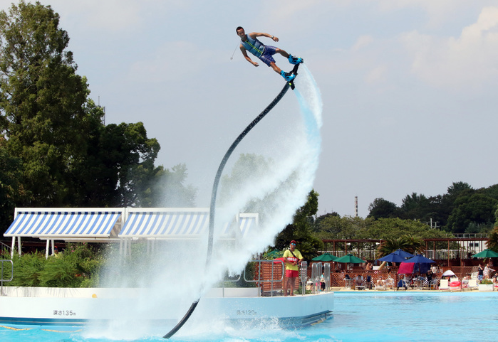 Continuing heat wave throughout the archipelago, swimming pools in central Tokyo were crowded. August 10, 2018, Tokyo, Japan   A Japanese hydrojet rider performs in the air with a jetdeck which connects to a personal water craft with a hose at a swimming pool of the Toshimaen amusement park in Tokyo on Friday, August 10, 2018. The amusement park started the water show through August 19 to attract holidaymakers for a week long Bon holidays.        Photo by Yoshio Tsunoda AFLO  LWX  ytd 