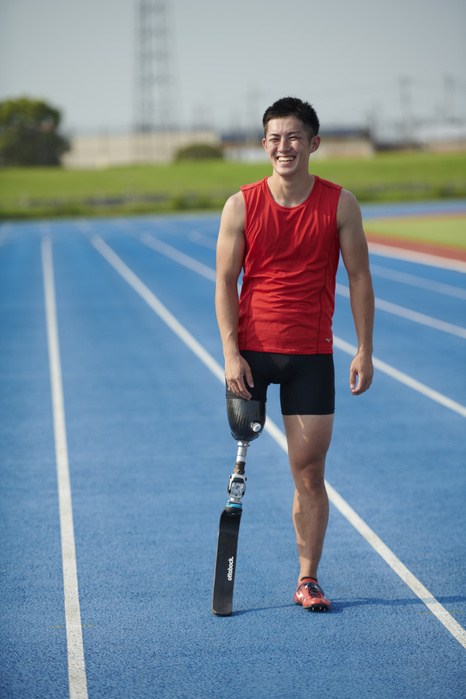Athlete with prosthetic track and field legs