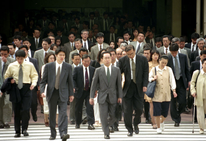People of the World  Salarymen in Japan  August 1997   Japan: August 1997 Tokyo   Japanese commuters are discharged from Tokyo Station.  Photo by Fujifotos AFLO   3618 