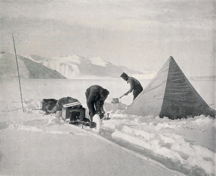  Heavy Sledging in New Snow Off Point Disappointment , December 1911,  1913 . Artist: Frank Debenham.  Heavy Sledging in New Snow Off Point Disappointment , December 1911,  1913 . Disappointment Camp on sea ice, Granite Harbour: an expedition member shovels snow into a cooker next to a pyramid tent. The final expedition of British Antarctic explorer Captain Robert Falcon Scott  1868 1912  left London on 1 June 1910 bound for the South Pole. The Terra Nova Expedition, officially the British Antarctic Expedition  1910 1913 , included a geologist, a zoologist, a surgeon, a photographer, an engineer, a ski expert, a meteorologist and a physicist among others. Scott wished to continue the scientific work that he had begun when leading the Discovery Expedition to the Antarctic in 1901 04. He also wanted to be the first to reach the geographic South Pole. Scott, accompanied by Dr Edward Wilson, Captain Lawrence Oates, Lieutenant Henry Bowers and Petty Officer Edgar Evans, reached the Pole on 17 January 1912, only to find that the Norwegian expedition under Amundsen had beaten them to their objective by a month. Delayed by blizzards, and running out of supplies, Scott and the remainder of his team died at the end of March. Their bodies and diaries were found eight months later. From Scott s Last Expedition, Volume II.  Smith, Elder   Co., London, 1913 