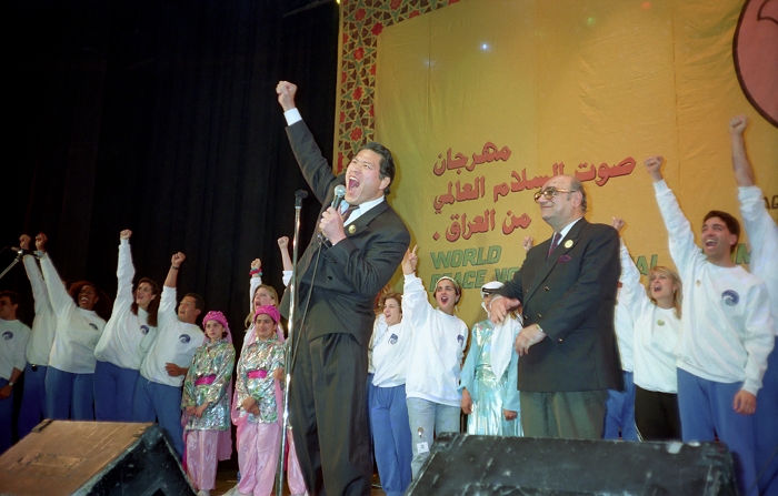 A. Inoki Iraq  Festival of Peace Antonio Inoki, Member of the House of Councillors, joins Iraqis and Americans in shouting for peace at the  Festival of Peace  in Baghdad, Iraq on December 2, 1990. National Theater, Baghdad, Iraq, December 2, 1990  Date 19901202  Date   Location Baghdad, Iraq National Theater