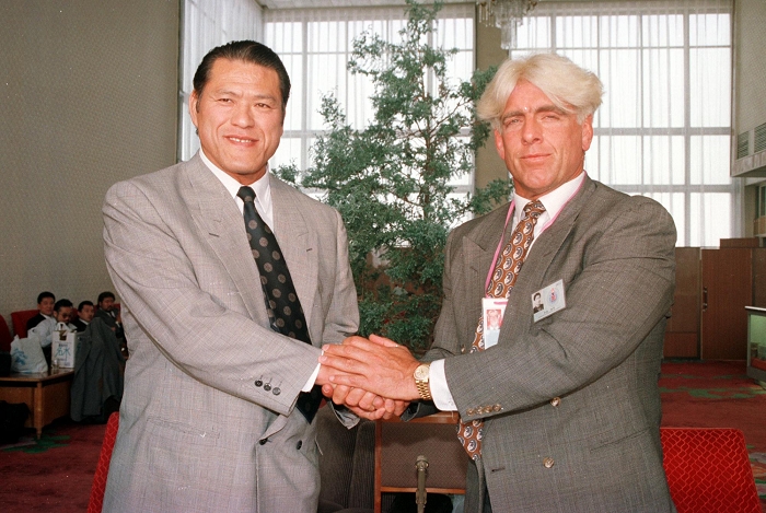 A. Inoki North Korea  Festival of Peace Antonio Inoki  JPN , Ric Flair  USA , Antonio Inoki  left  shakes hands with Ric Flair for a souvenir photo as they return home after participating in the Pyongyang International Sports and Cultural Celebration for Peace, May 1, 1995, at Pyongyang Airport, North Korea.  Date 19950501  Date   Location  Pyongyang Airport, North Korea