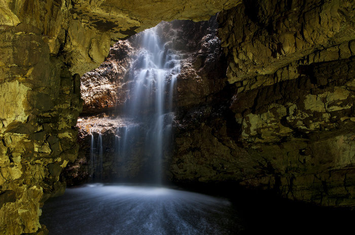 Waterfall flowing through sinkhole into cave, Allt Smoo, Smoo Cave, Durness, Sutherland, Highlands, Scotland, August, Photo by Dave Pressland