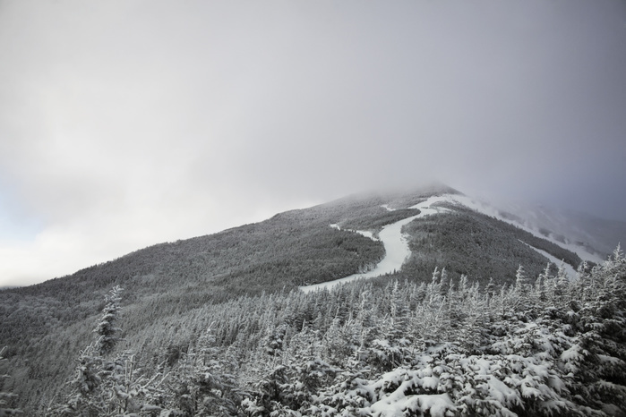 New York, United States of America Snow covered trees on mountain against cloudy sky