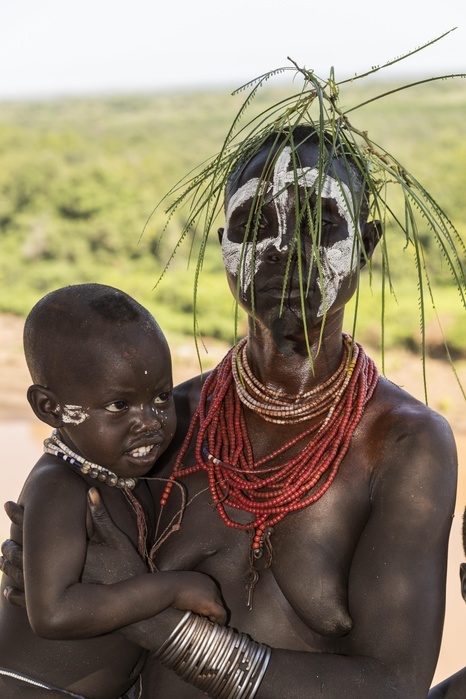 Young woman with toddler, with head and necklaces, Karo tribe, Omo River, Southern Nations Nationalities and Peoples' Region, Ethiopia, Africa, Photo by Günter Lenz
