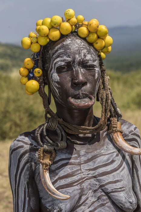 Woman with lip plate and headdress, portrait, tribe of the Mursi, Southern Nations Nationalities and Peoples' Region, Ethiopia, Africa, Photo by Günter Lenz