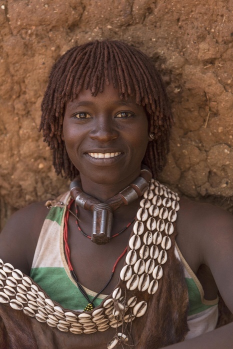 Woman, smiling, portrait, Hamer tribe, Turmi market, Southern Nations Nationalities and Peoples' Region, Ethiopia, Africa, Photo by Günter Lenz