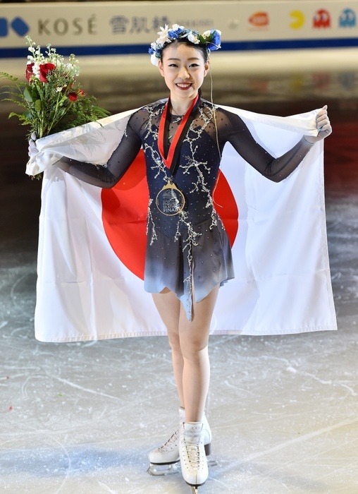 2018 GP Finals Women s Podium Ceremony Rika Kihira holds up the Japanese flag around her gold medal after winning the Grand Prix Final at the Doug Mitchell Thunderbird Sports Centre on December 8, 2018 in Vancouver, British Columbia, Canada  photo date 20181208  photo location British Columbia, Canada Vancouver, British Columbia, Canada