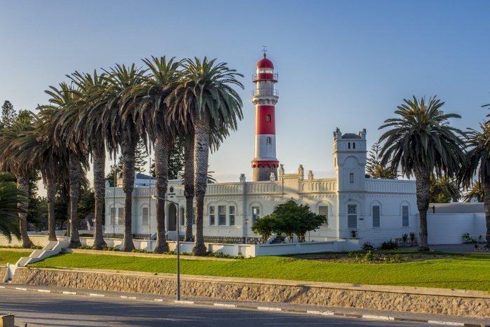 Namibia The old State House and former Imperial District Court from colonial times, in the background the lighthouse of 1902, Swakopmund, Erongo region, Namibia, Africa