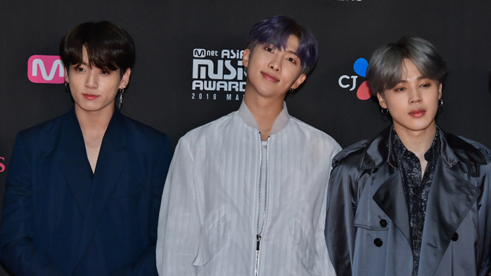 2018 MAMA Fan s Choice in Japan  L R JungKook, RM and Jimin of South Korean group BTS attend the  2018 Mnet Asian Music Awards MAMA  Fan s Choice in Japan  at the Saitama Super Arena in Saitama Prefecture, Japan on December 12, 2018.