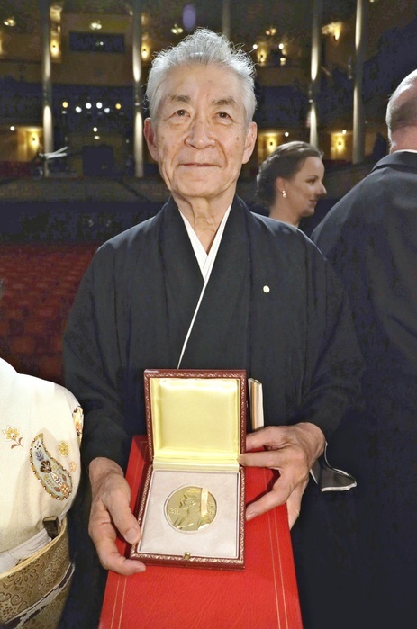 Professor Tasuku Honjo, Kyoto University, holds his medal and certificate after the Nobel Prize ceremony. After the Nobel Prize ceremony, Special Professor Tasuku Honjo of Kyoto University holds his medal and certificate for the Prize in Physiology or Medicine in the afternoon of May 10, 2012, in Stockholm. After the Nobel Prize ceremony, Special Professor Tasuku Honjo of Kyoto University holds his medal and certificate for the Prize in Physiology or Medicine, in Stockholm on the afternoon of December 10, 2018. Photo taken on December 10, 2018