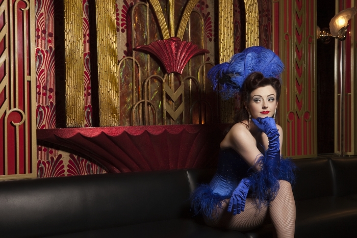 Showgirl sitting on couch