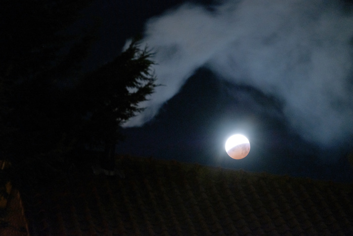 Super blood wolf moon The  super blood wolf moon  is seen under a smoke from a chimney of a house during a total lunar eclipse January 21, 2019, in Katwijk, Netherlands.  Photo by Yuriko Nakao AFLO 