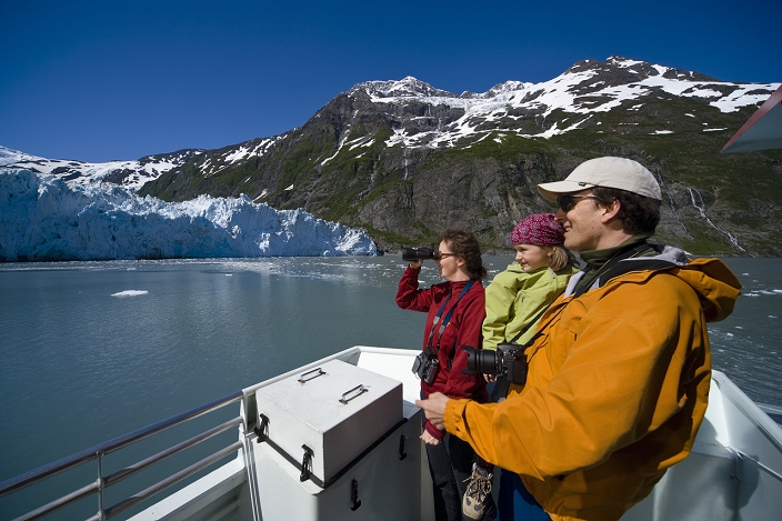 Famiily sight seeing in Harriman Fjord from the deck of the Klondike Express tour boat, Prince William Sound, summer, South Central Alaska