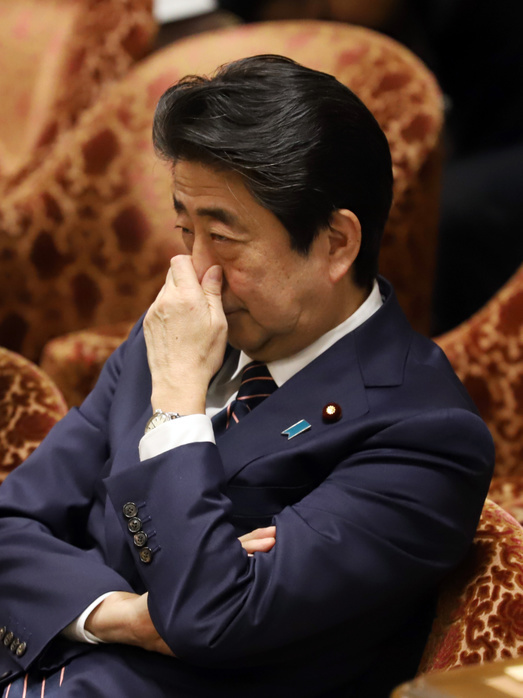 Diet, Budget Committee of the House of Representatives February 18, 2019, Tokyo, Japan   Japanese Prime Minister Shinzo Abe pinches his nose as he listens to a question by an opposition lawmaker at Lower House s budget committee session at the National Diet in Tokyo on Monday, February 18, 2019. Abe cabinet is now under fire on data scandal as health, labor and welfare ministry has admitted an improper method in a wage structure survey.   Photo by Yoshio Tsunoda AFLO 
