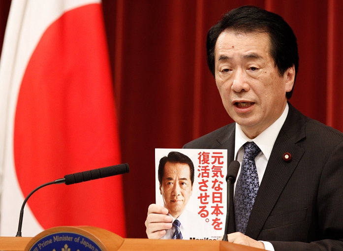 Tax system to be discussed after Upper House election Prime Minister Kan s press conference June 21, 2010, Tokyo, Japan   Japanese Prime Minister Naoto Kan shows a copy of the election manifesto of the ruling Democratic Party of Japan during a news conference at the prime minister s official residence in Tokyo on Monday, June 21, 2010. Kan stressed sturdy finances are vital for supporting a strong economy and society. Kan proposed to start debating a possible sales tax hike after July 11 upper house elections to bring down Japan s huge public debt.  Photo by Tatsuyuki Tayama Gamma AFLO   3609   mis 