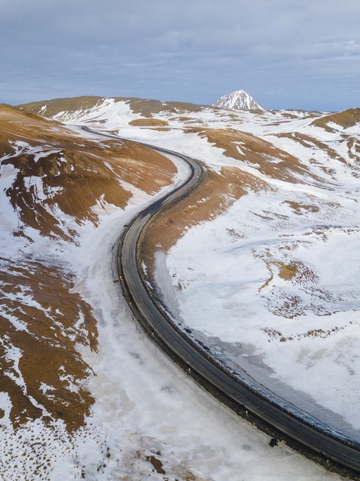 Iceland Aerial view, winding road, ring road, near geothermal area Hverar nd, also Hverir or Namaskard, North Iceland, Iceland, Europe, Photo by Moritz Wolf