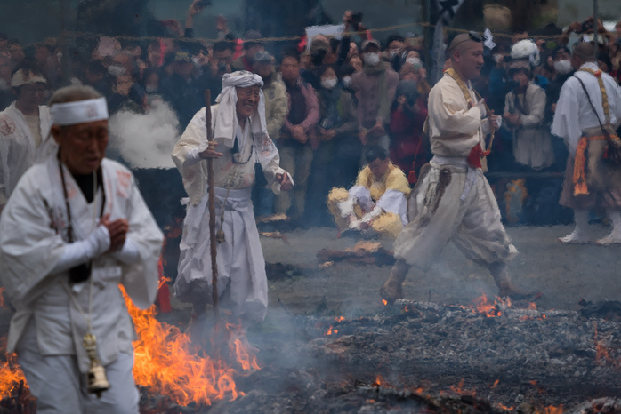 Tokyo, Hiwatari sai festival at Mount Takao  Yamabushi  walks on ashes during a fire walking ceremony  Hiwatari sai festival in Japanese  which heralds the coming of spring, at Yakuoin Temple on Mt. Takao in the city of Hachioji in western Tokyo, 10 March 2019. Hundreds of faithfull followed  yamabushi  monks and took part in a ceremony for  purifying their minds and bodies  and to pray for good health and safety by walking barefoot across a fire that is smoldering and still partially burning. Hachioji, JAPAN 10 March 2019. March 10, 2019  Photo by Nicolas Datiche AFLO   JAPAN 