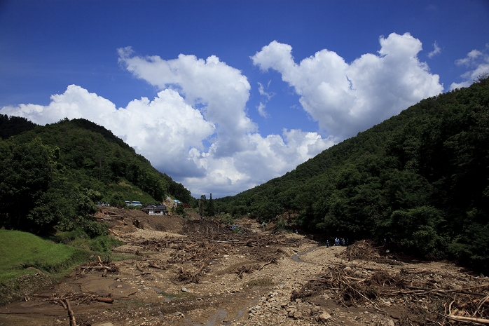 Landslide in Shobara, Hiroshima Torrential rain damage throughout western Japan July 19, 2010, Shohara, Japan   Rescuers shift through a field ravaged by mudslides at a village in Shohara City, Hiroshima prefecture, western Japan, on Monday, July 19, 2010. Some 300 rescuers, including police, firefighters and Ground Self Defense Force troopers, were mobilized in search for an 87 year old woman who has been missing since July 16. The village was one of many in western and central Japan devastated by mudslides triggered by continuing torrential rains.  Photo by Noriyuki Araki AFLO   3076   mis 