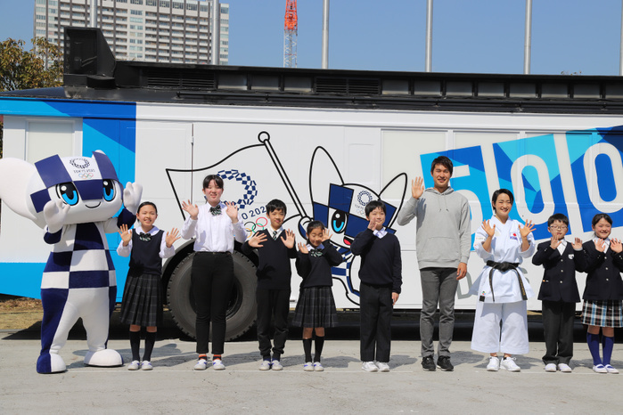 Tokyo 2020 Olympic Games 500 Days Ahead Event: 500days Boat Unveiling   Departure Ceremony March 12, 2019, Tokyo, Japan   Rio de Janeiro Olympic 4x100 relay silver medalist Shota Iizuka  4th R  and karateka Kiyo Shimizu  3rd R , accompanied by school children and a mascot Miraitowa  L  pose before a wrapping bus for the promotion of the Tokyo 2020 Olympic Games in Tokyo on Tuesday, March 12, 2019. The bus with logo of the 500days to go for Tokyo 2020 Olympics started a caravan for the promotion of the next year s Summer Games.     Photo by Yoshio Tsunoda AFLO 