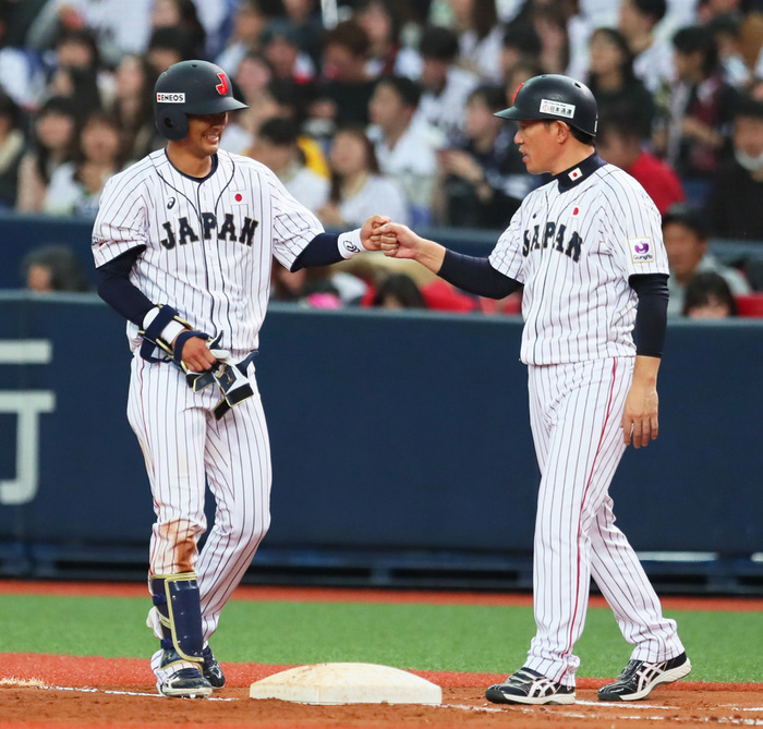 Samurai Japan Series 2019 Naoki Yoshikawa  left  exchanges go ahead runs after giving up an infield single in the bottom of the seventh inning of the Samurai Japan Friendly Match between Japan and Mexico, March 10, 2019 date 20190310 place Kyocera Dome Osaka