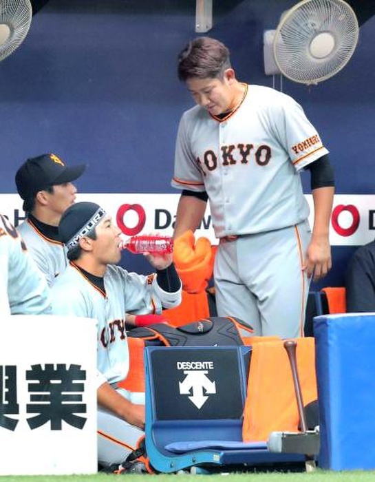 2019 Professional Baseball Open Game Open game. Orix Giants. Tomoyuki Kanno of the Giants talks with Ginro Sumitani  front left  on the bench. Photo taken March 8, 2019, at Kyocera Dome Osaka. 