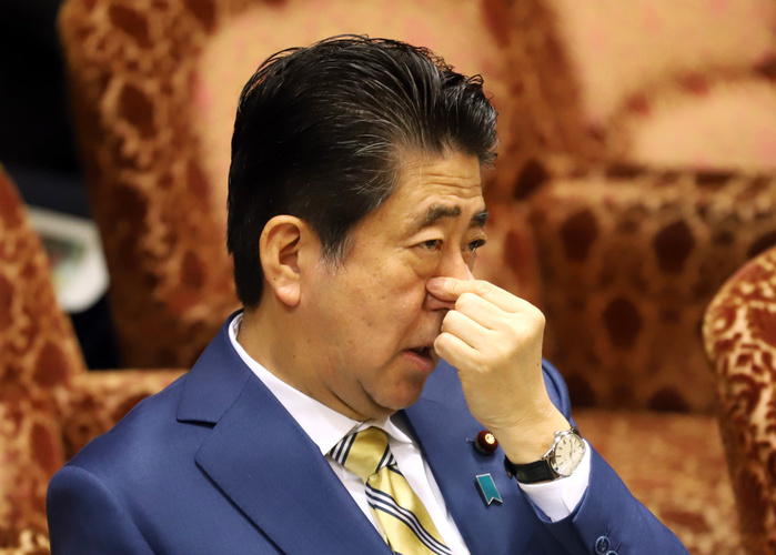 Budget Committee of the House of Councillors March 14, 2019, Tokyo, Japan   Japanese Prime Minister Shinzo Abe pinches his nose as he listens to a question at Upper House s budget committee session at the National Diet in Tokyo on Thursday, March 14, 2019. Lower House passed a record 101 trillion yen budget for fiscal 2019 early this month.     Photo by Yoshio Tsunoda AFLO 