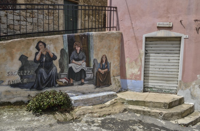 Mural of Sardinian women, village life, artist Pasqualino Baingiu, Orgosolo, Province of Nuoro, Sardinia, Italy, Europe, Photo by Fabian von Poser