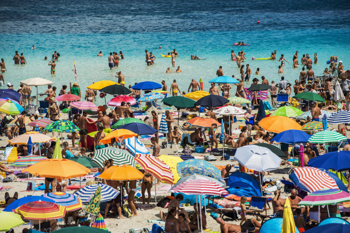 Italy Tourists enjoying the turquoise waters of famous Pelosa Beach  Stintino, Sardinia, Italy, Photo by Dosfotos