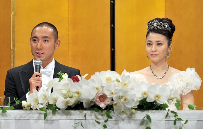 July 29, 2010, Tokyo, Japan - Newly-wedded couple, Kabuki actor Ichikawa Ebizo and former Mao Kobayashi, attends a news conference following their Some 1,000 guests were on hand to celebrate the wedding of the strikingly handsome actor, a direct Some 1,000 guests were on hand to celebrate the wedding of the strikingly handsome actor, a direct descendant of one of kabuki's most revered acting families dating back to the 17th century, and a former TV announcer. Sakai/AFLO)