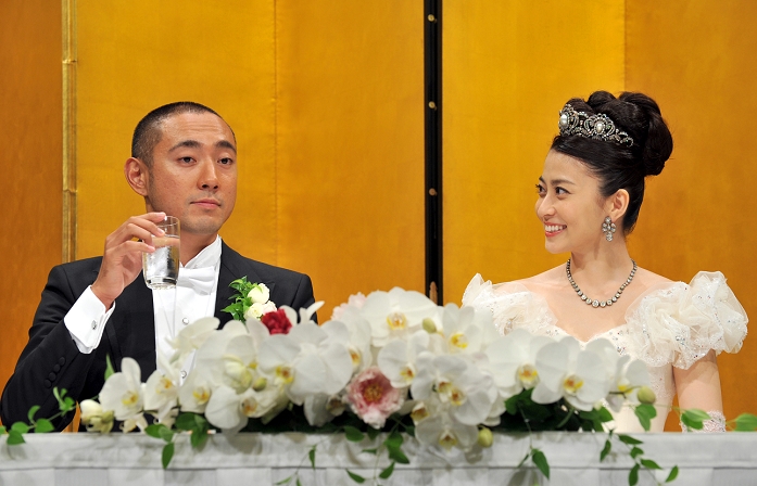 July 29, 2010, Tokyo, Japan - Newly-wedded couple, Kabuki actor Ichikawa Ebizo and former Mao Kobayashi, attends a news conference following their Some 1,000 guests were on hand to celebrate the wedding of the strikingly handsome actor, a direct Some 1,000 guests were on hand to celebrate the wedding of the strikingly handsome actor, a direct descendant of one of kabuki's most revered acting families dating back to the 17th century, and a former TV announcer. Sakai/AFLO)