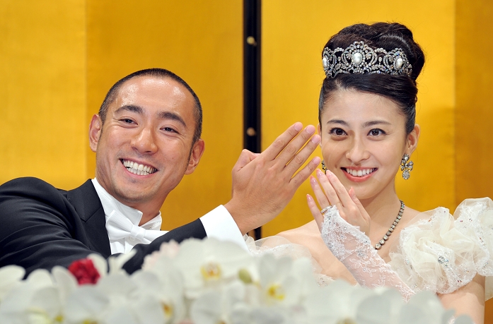 July 29, 2010, Tokyo, Japan - Kabuki actor Ichikawa Ebizo and his bridge, former Mao Kobayashi, show off their wedding rings to during a news conference Some 1,000 guests were on hand to celebrate the wedding of the strikingly handsome actor, a direct descendant of one of kabuki's most revered acting families dating back to the 17th century, and a former TV announcer. by Natsuki Sakai/AFLO) [3615] -mis-