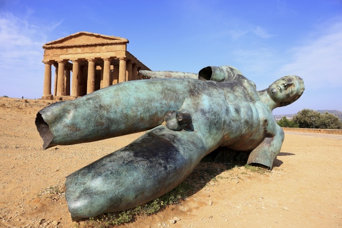 Italy Valle dei Templi di Agrigento, Concordia temple with the sculpture of the crashed Icarus by the artist Igor Mitorgi, Agrigento, Sicily, Italy, Europe, Photo by BAO