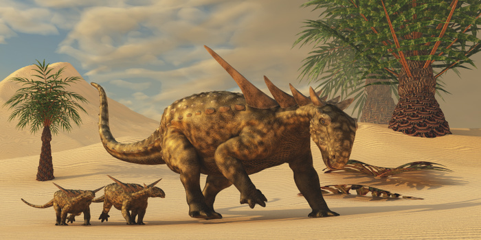 A Sauropelta mother leads her offspring in a desert area of North America. A Sauropelta mother leads her offspring in a desert area of North America.