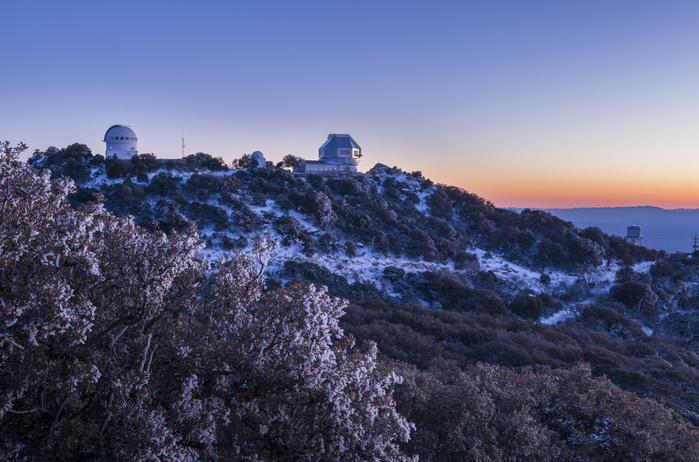 The WIYN Observatory on top of snow capped Kitt Peak, Arizona. The WIYN Observatory on top of snow capped Kitt Peak, Arizona.