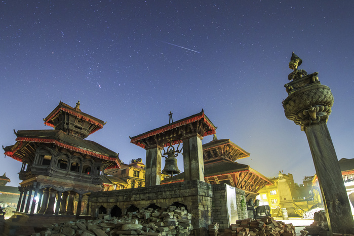 A meteor streaks the sky above Bhaktapur Durbar Square of Nepal. A meteor streaks the sky above Bhaktapur Durbar Square of Nepal.